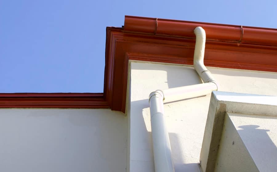 Eavestrough and fascia along a roof edge